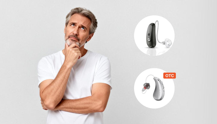 Thoughtful mature man comparing prescription hearing aid and ELEHEAR OTC hearing aid while deciding suitable hearing assistance option against plain grey background