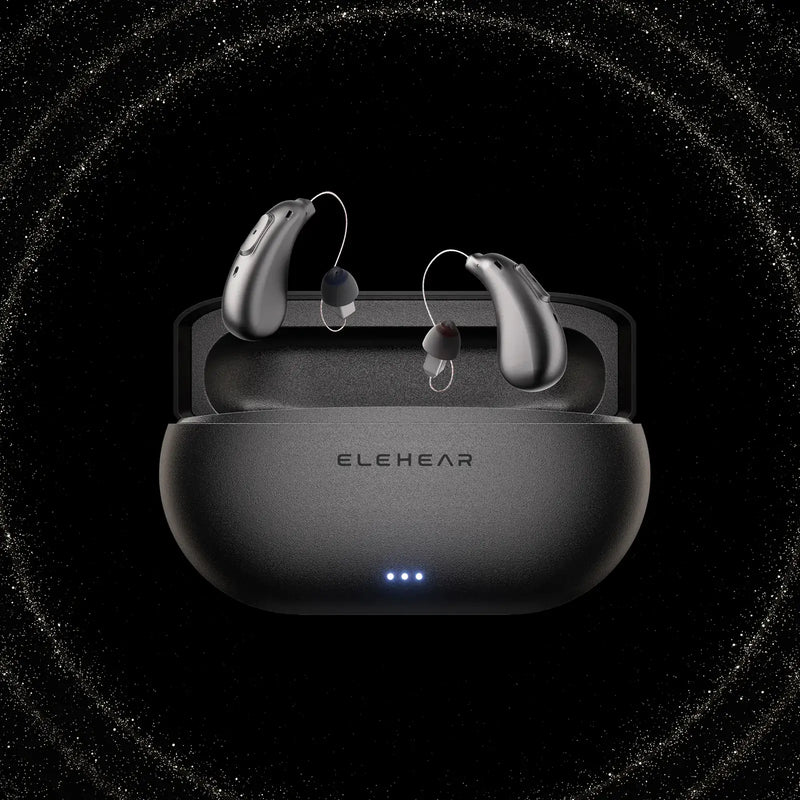 ELEHEAR Beyond Pro silver hearing aids in charging case with blue LED indicators on black background