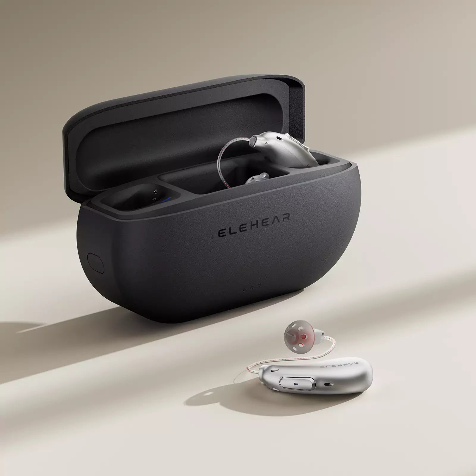ELEHEAR rechargeable hearing aids with portable charging case, showing BTE devices and compact storage solution