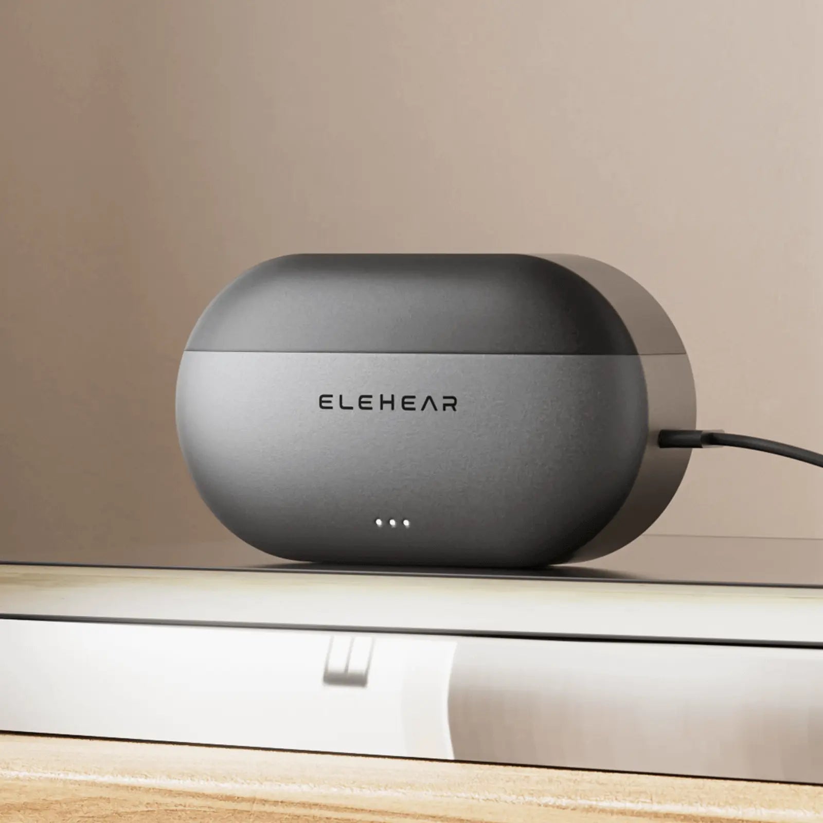 ELEHEAR rechargeable hearing aid charging case with LED indicators and USB-C cable on wooden surface