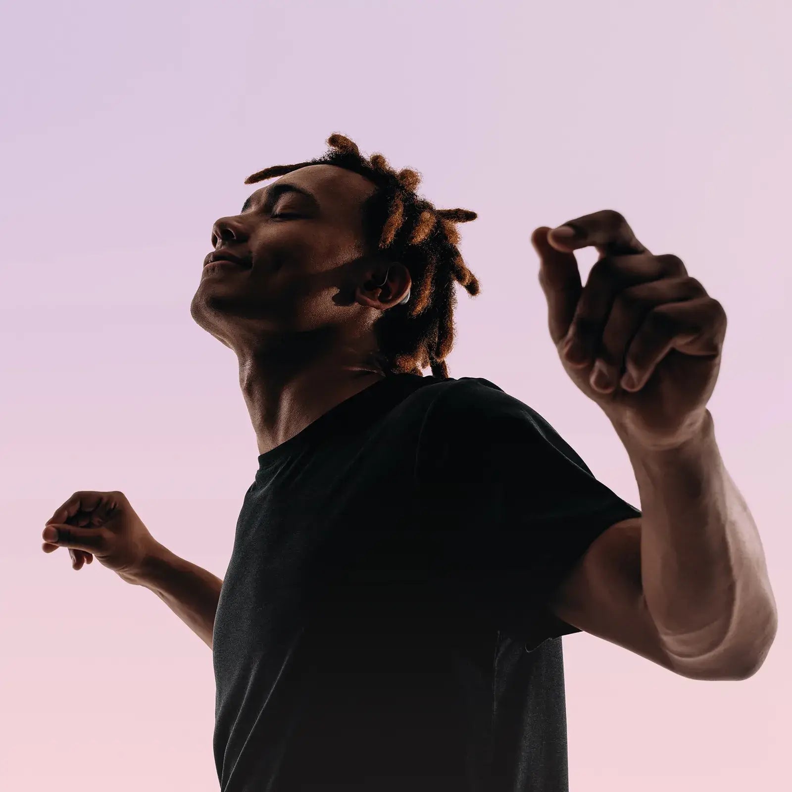 Man listening to music with hearing aids showing enhanced audio quality and music mode feature